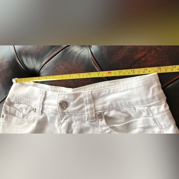 Low rise Shorty shorts - white jean 34” hip/lower waist as it sits lower.   9/10 - Picture 3 of 9